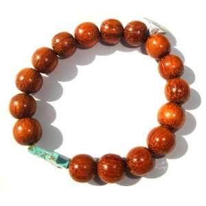   Wood bead Bracelet Accentuated By A 10mm Turquoise Cross Jewelry