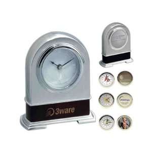   polished silver metal quartz clock with second hand.