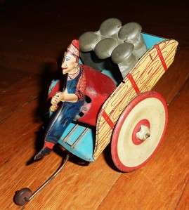   auction is for a Antique Tin Windup Working Milk Cart Hee Haw Toy