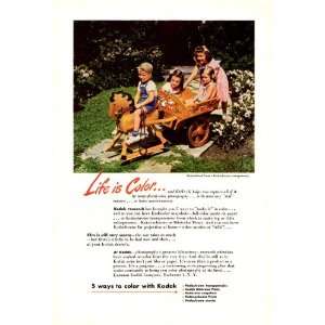 1945 Kodak Ad Kodachrome Life is Color Children on Toy Horse Wagon 