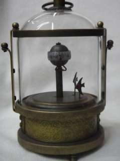 Wonderful glass and brass fish vat machine clock  