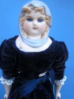 China doll by Emma Clear with blue scarf matching blue dress marked