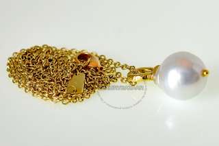   yellow gold is beautifully paired with a lustrous large Baroque pearl