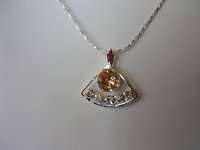 Champagne Crystal Pendent on a 15 Silver Plated Chain  