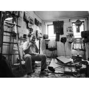  Jim Dine Sitting in Cluttered Studio/Apartment, Holding 