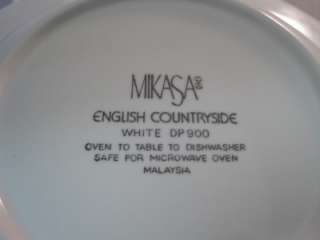   Four rimmed soup bowls in the English Countryside pattern by Mikasa