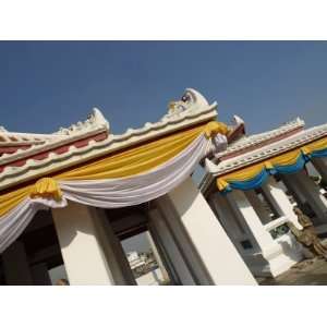 Exterior of Ornate Building Draped in Colorful Fabric in Thailand 