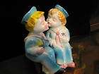 vintage cute kissing couple salt and papper shakers with bench returns 