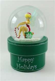 Shake the snowglobe to send glitter swirling around Tinker Bell Faux 