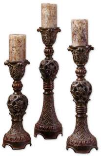 These candlesticks feature an intricate carving design finished in 