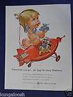   BELL TELEPHONE,TOY SPACESHIP PEDAL CAR BY A BABY ON A TOY PHONE ART AD