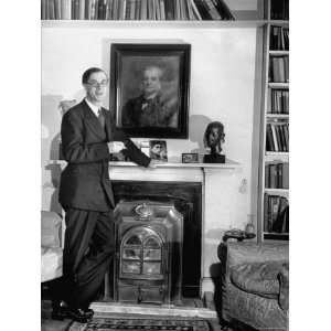  Biologist Dr. Julian Huxley Standing Beside His Fireplace 