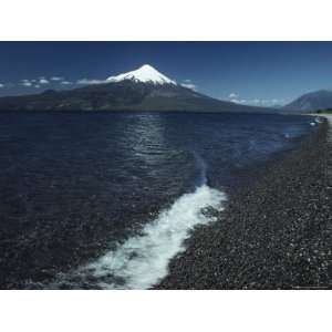  The Snow Capped Top of Osorno Volcano Towers over Lake 