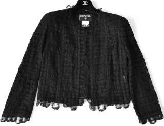   lace jacket with looped lace trim and metal CC plaque at the waist