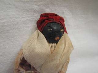 An early Black American finger puppet doll. In fair to good condition 